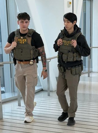 Phot of very young looking TSA Agents at the airport.