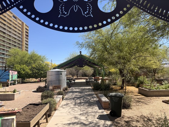 Photo of The entrance of the Blue Moon Garden with a walkway leading to the ramada.  