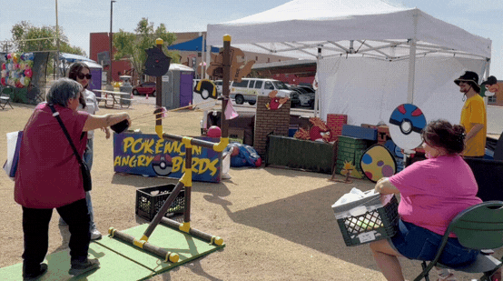 GIF of Tucson House resident, Sonia, getting in on the fun and playing the Pokémon Angry Bird game.