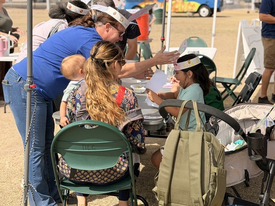 Photo of A child excited to put on their bunny ears they decorated.