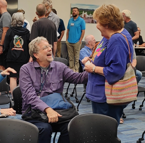 Photo of Council Member Kevin Dahl Speaking with Resident.