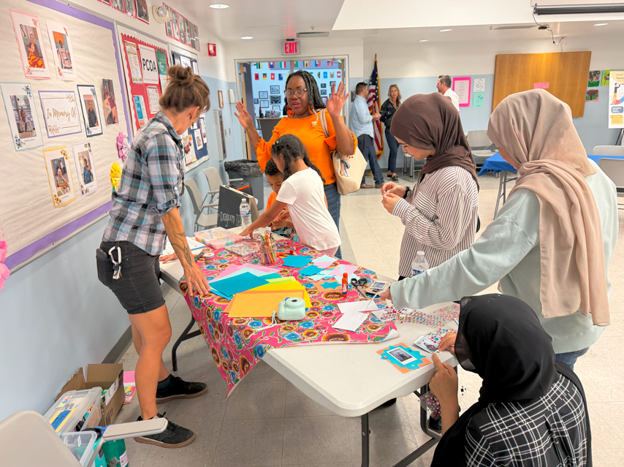 community members visit booths during a 29th Street Thrive Zone event