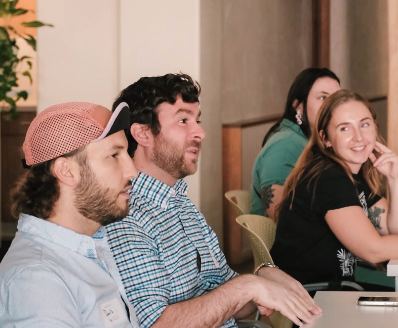 4 young professionals participate in a community dialogue