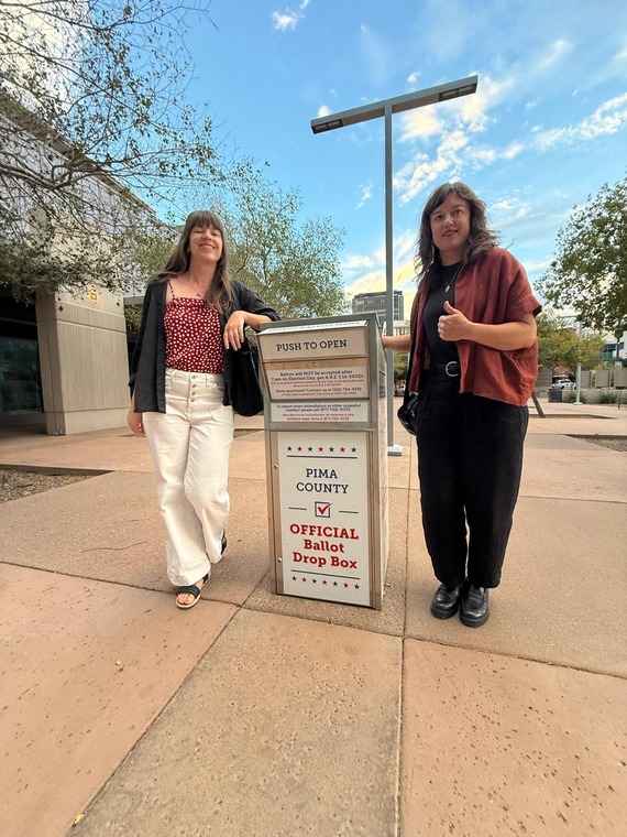 Miranda and Lisa outside of a ballot drop box