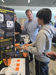 3D Printed Arm Competition Winners speak to Supervisor Haubert