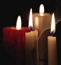 Photo of four lit candles