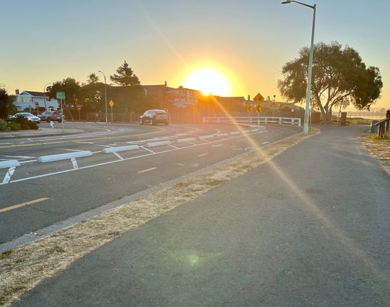 Photo of sun glare on roadway heading east on Shore Line Dr