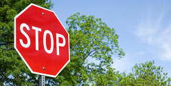 Image of Stop Sign with trees in background