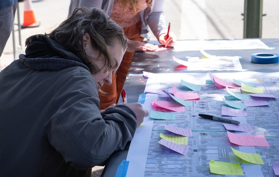 Photo of person writing comments on a concept plan