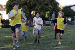 Kids having fun running in a green field