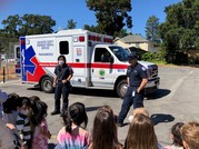 EMTs giving demonstration to young children