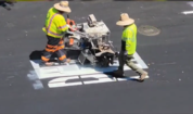 Pavement Preservation workers painting the new road