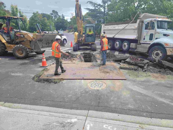 Sewer Rehab - Image of crews working on roadway