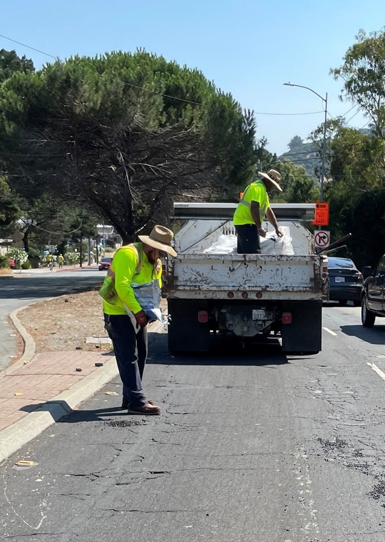 Filling potholes along Ralston Avenue in August 2023