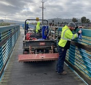 Photo of staff cleaning graffiti on Children's Bridge