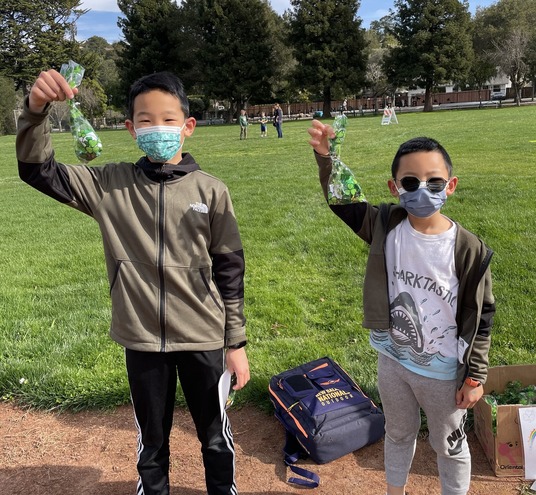 Two children at the shamrock scavenger hunt