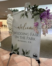 Sign with flowers that reads welcome! Wedding Fair in the Park, Belmont, CA