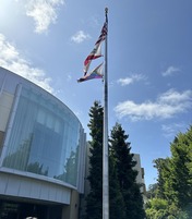 Pride flag raised in front of city hall