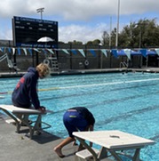Two kids at a swimming pool