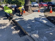 Staff finishing concrete pathway