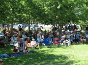 People sitting at the Summer concerts at the park 