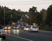 Cars driving past an intersection