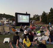 People watching a movie in Barrett park