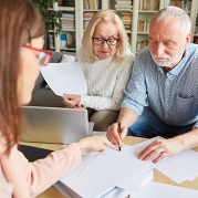 Couple Reviewing Paperwork at Power of Attorney Clinic