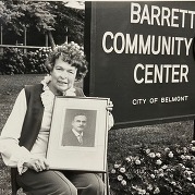 Ruth Barrett Holding a Picture of Her Father in Front of Barrett Community Center