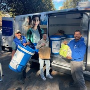 Food drive bins and staff setting up