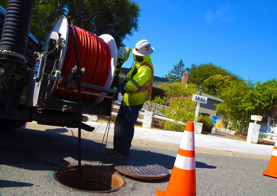 Belmont public works working on a drain