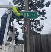 Staff replacing a street sign