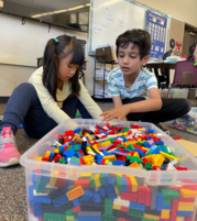 Kids playing with legos at  a recreation activity 