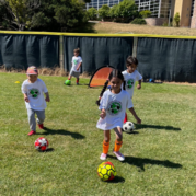 Kids playing soccer in our afterschool program