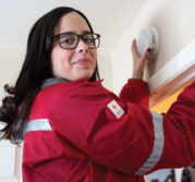 Someone checking on a smoke detector