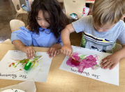 Two kids doing an art project 