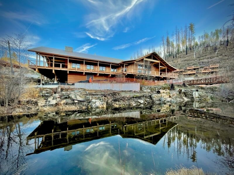 An image of the new Berkeley Tuolumne Camp Dining Hall and South Fork Tuolumne River