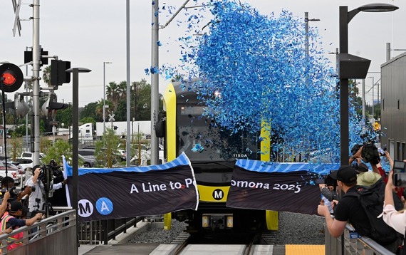 Train Going Through Confetti and Sign