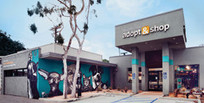 Adopt & Shop building facade with mural of animals