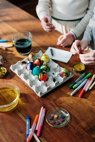 photo of children coloring eggs