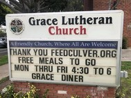 Grace Luthern Church sign with FeedCulver information: free food available Monday to Friday 4:30 pm - 6 pm 