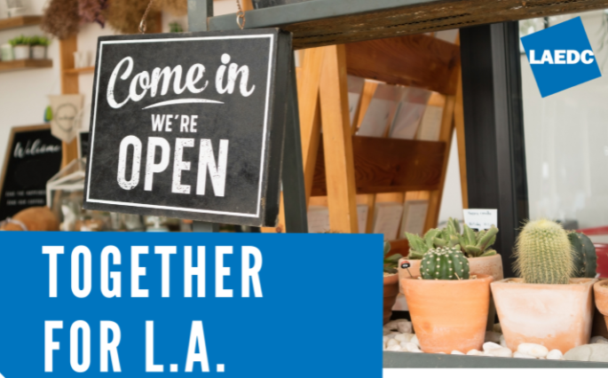 Together for L.A. LAEDC; photo of a sign in a shop window "Come in we're open"
