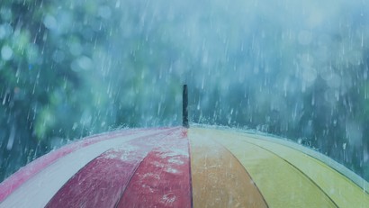 Umbrella with rain falling on it