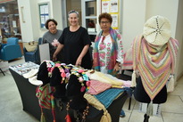Women selling crocheted items