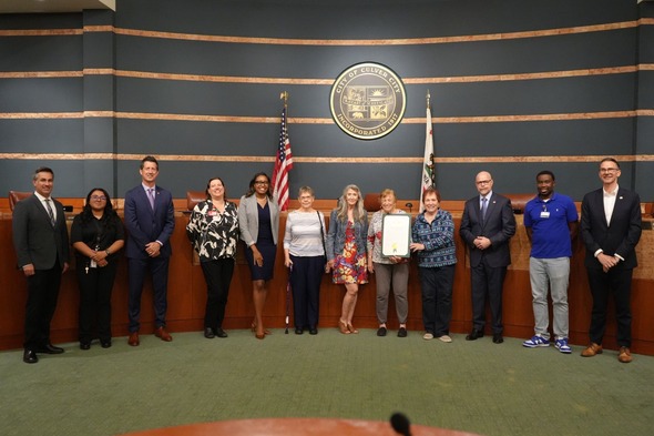 Photo of City Council and members from PRCS and Senior Center with the proclamation of May as Older Americans Month