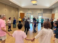 Participants dancing in a circle