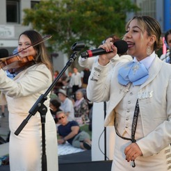 Photo of three women playing music during Summer Sunset Concert Series