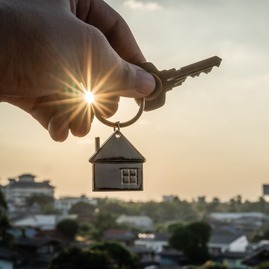 Photo of key with with keychain overlooking sunset