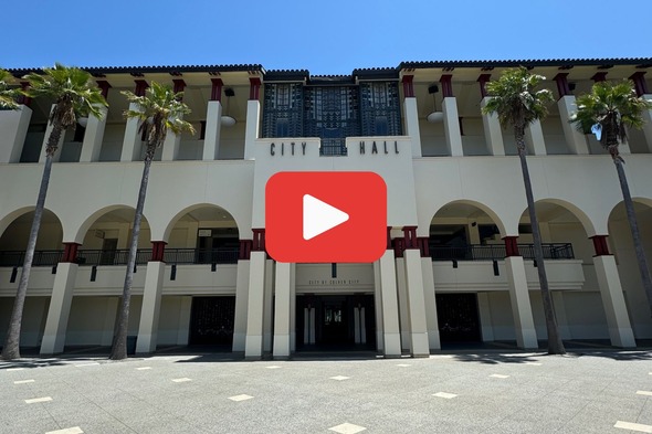 Photo of City Hall with play button linking to a video showing how to access the permitting portal