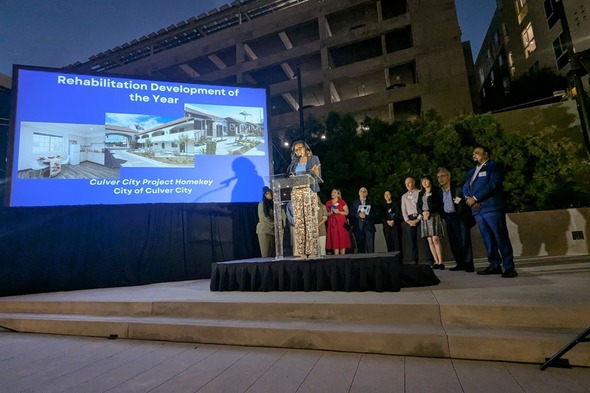 Photo of award ceremony with Culver City staff and Mayor accepting Rehabilitation Development of the Year